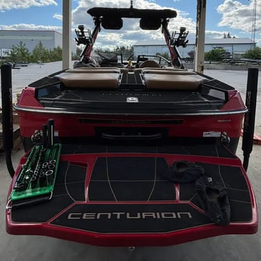 Centurion wake boat on lift at Ontario marina - wake and surf performance service by STO Boats