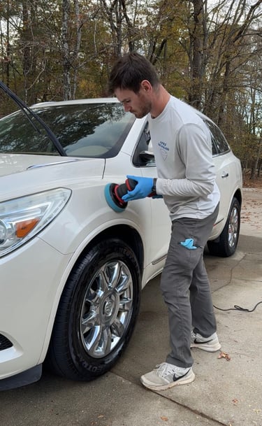Man buffing buick car