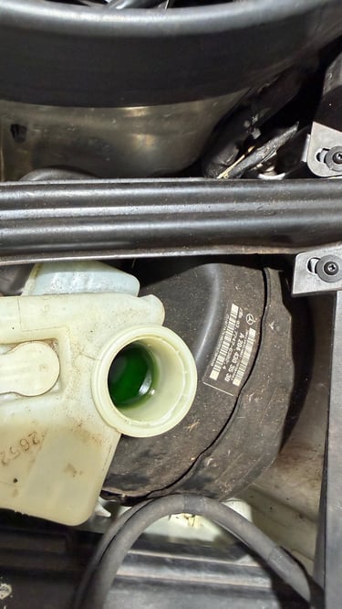 old brake fluid that is green due to lake of maintenance