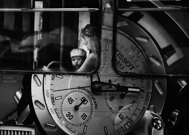 Monochrome image of woman and child in a mirror