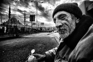 lack and white street image with dynamic shadows and light of older bearded man.