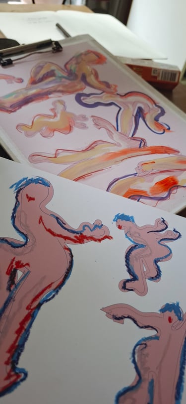 Works in progress showing drawings of figures