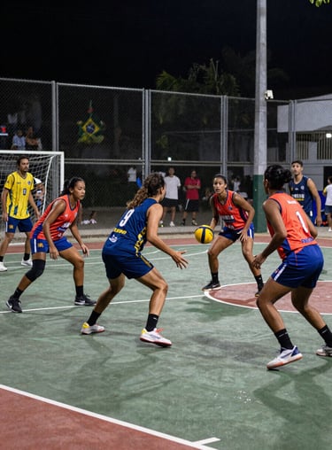 A vibrant action shot of a sports competition between units in a Brazilian open-air court, filled with energy and teamwork.