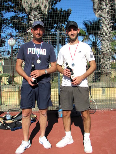 Both Players With Their Medals and Prize Wines