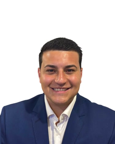 Professional headshot of a smiling man in a blue suit jacket and white shirt.