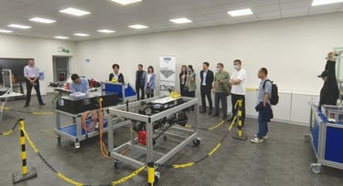 a group of people from other countries visit the lab