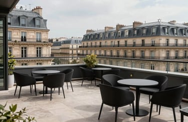 A wide shot of a luxury rooftop terrace in Paris, featuring European / Parisian French architecture and minimalist black furniture.