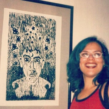 woman smiling next to art