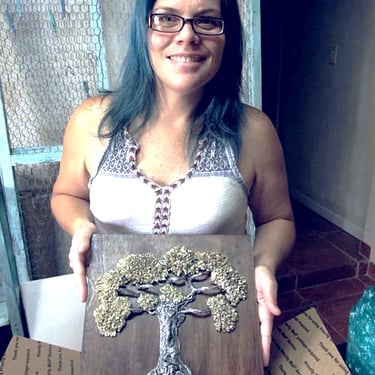 artist holding artwork