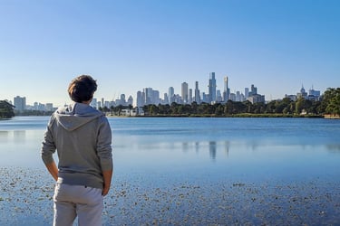 Me in Albert Park staring at the skyline of Melbourne