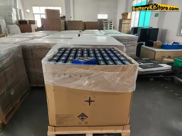 boxes of LiFePO4 prismatic battery cells in a warehouse