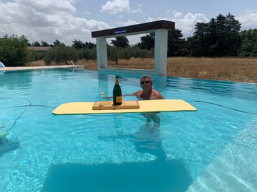 Guest enjoying the infinity swimming pool at Domaine Des Lucques