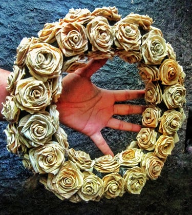 Natural corn husk wreath on the hand