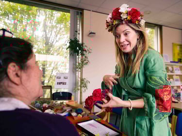 A lady in a flower crown and tranditional polish garb having a conversation