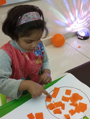 Child focused on creative sensory therapy activity