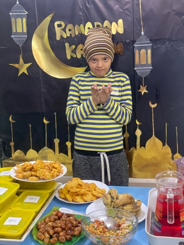 "Slice of decadent cake with layers of cream and fruit, presented on a decorative plate."