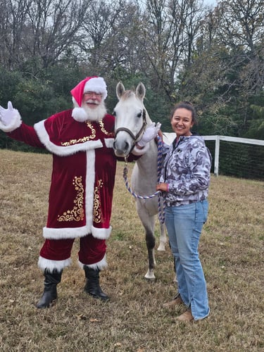 The Santa Cowboy with horse "Titan" snd owner Emma