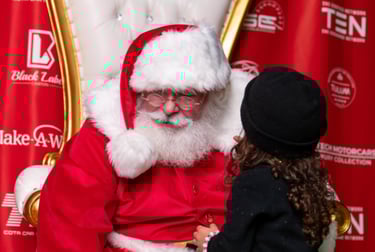 The santa Cowboy being told a secret Christmas wish