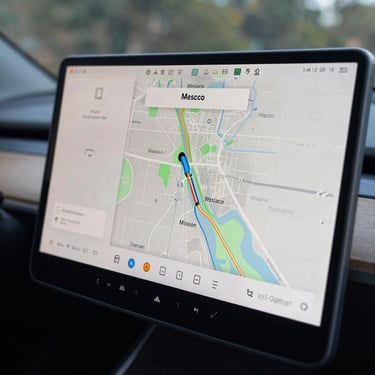 Macro shot of a modern car's digital navigation display showing a map of Weslaco and Mission, Texas, sharp focus, technological and modern style.