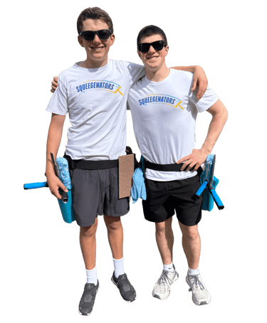 Squeegenators, Eddie Sislo and Logan Fotsch, are standing arm in arm, next to each other. 