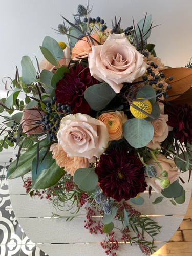 A gorgeous bouquet of flowers and berries.