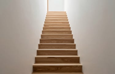 An elegant, floating wooden staircase in a bright hallway. Focus on high-quality materials, professional craftsmanship, and minimalist luxury.