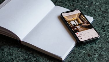 An Executive Suite featuring pale mint walls, bespoke dark wood furniture, and elegant Lora-style typography on a welcome card.
