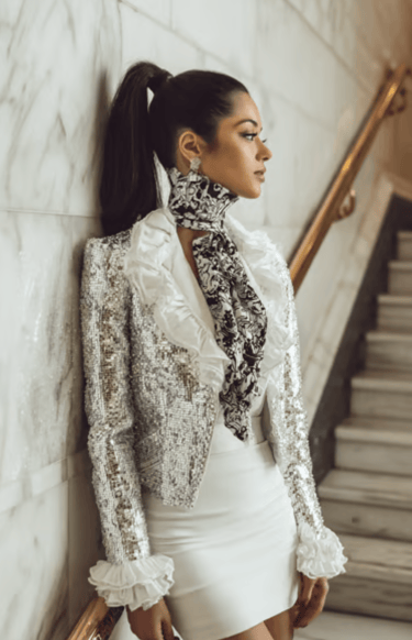 High-fashion editorial image featuring sophisticated hair and makeup design, radiant complexion and 