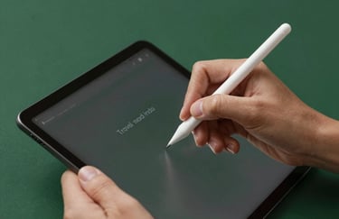 Close-up of a hand using a digital stylus on a tablet to edit social media content for a travel and tourism client, with a Matte Forest Green (#224236) background.