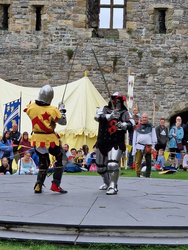 knights in battle at Caernarfon castle Wales
