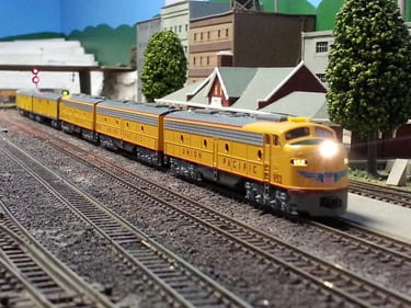 A UP passenger rolls through Tabar