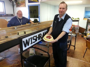 Wishram celebration - Stuart presents the cake