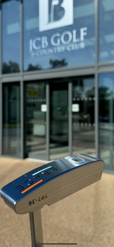 Brace forged golf putter in front of clubhouse close