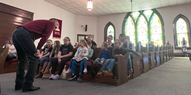 Moran UMC Pastor Tracy Smith talking to the UMC kids at Children's Time during Sunday service