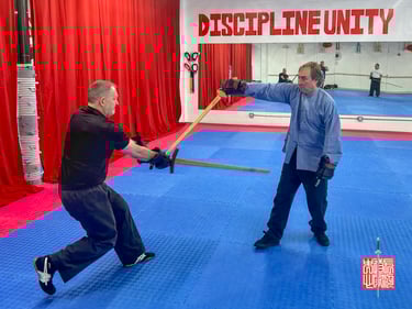 Laoshi Scott Rodell doing light sparring with Jian vs european longsword from our workshop in September 2024.