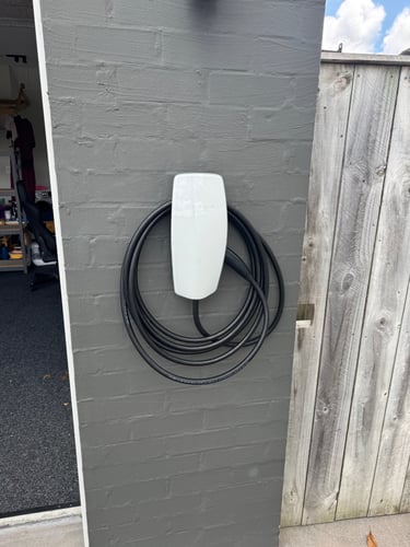 Tesla Gen 3 wall charger installed in Auckland residential garage by certified electrician