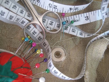 Sewing sundries with tape measure, pins and scissors