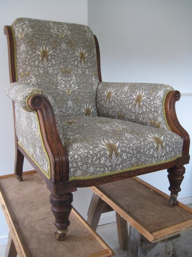 Victorian armchair with new traditional upholstery and a patterned cotton fabric by William Morris