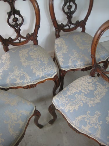 Antique Victorian dining chairs with new traditional upholstered sprung seats and blue and gold damask fabric by Mulberry 