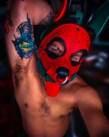 Man posing in pup mask and gear,