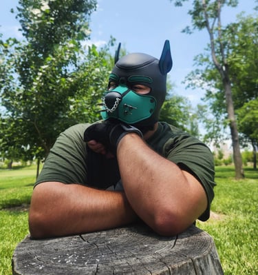 A man in a pup mask posing outdoors.
