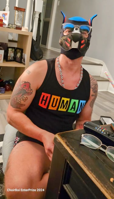 A man posing in a pup mask.