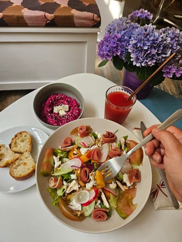 Gourmet salad at Mlle & Potts Co. with cured ham, fresh goat cheese, radishes and beet hummus