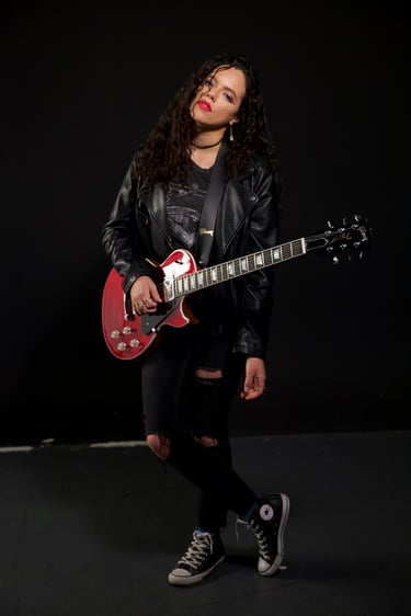 Rayssa Slater SAG Actor & Musician - stands with guitar les paul modern