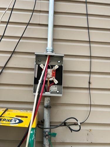 Electrical disconnect box installation on exterior wall in Reading PA