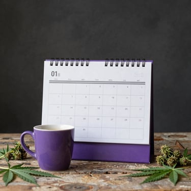 grey and black pen on calendar book