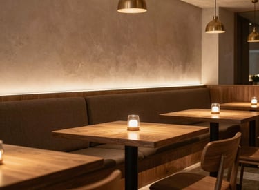 A stylish restaurant interior in São Paulo with minimalist wooden tables and warm, cozy lighting.