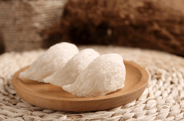 High-quality raw edible bird's nests on a wooden plate for traditional health soup.
