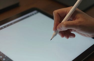 A close-up of a designer's hand using a precision stylus on a modern screen, focused and creative lighting, reflecting #F5F8FC and #A8BECD.