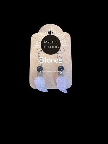 Handmade rose quartz angel wing earrings with obsidian beads on a Mystic Healing Stones card.